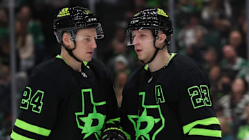 Dec 31, 2024; Dallas, Texas, USA; Dallas Stars defenseman Esa Lindell (23) talks to center Roope Hintz (24) iduring the second period against the Buffalo Sabres at American Airlines Center. Mandatory Credit: Tim Heitman-Imagn Images