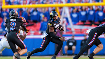 Nov 9, 2024; Kansas City, Missouri, USA; Kansas Jayhawks quarterback Jalon Daniels (6) runs the ball during the second quarter against the Iowa State Cyclones at GEHA Field at Arrowhead Stadium. Mandatory Credit: William Purnell-Imagn Images