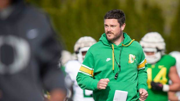 Oregon head coach Dan Lanning runs during practice with the Ducks Thursday, April 11, 2024, at the