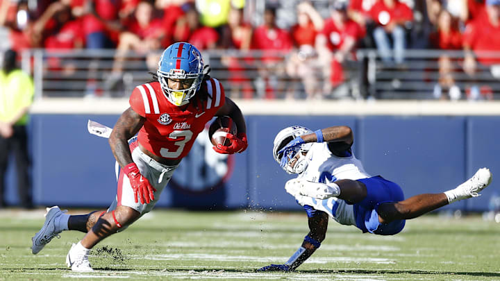 Sep 7, 2024; Oxford, Mississippi, USA; Mississippi Rebels wide receiver Antwane Wells Jr. (3) runs after a catch as Middle Tennessee Blue Raiders defensive back Jalen Jackson (23) attempts to make the tackle during the second half at Vaught-Hemingway Stadium. Mandatory Credit: Petre Thomas-Imagn Images