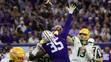 Dec 31, 2024; Houston, TX, USA; Baylor Bears quarterback Sawyer Robertson (13) passes against LSU Tigers defensive end Sai'vion Jones (35) in the second half at NRG Stadium. Mandatory Credit: Thomas Shea-Imagn Images