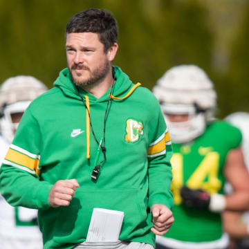 Oregon head coach Dan Lanning runs during practice with the Ducks Thursday, April 11, 2024, at the Hatfield-Dowlin Complex in Eugene, Ore.