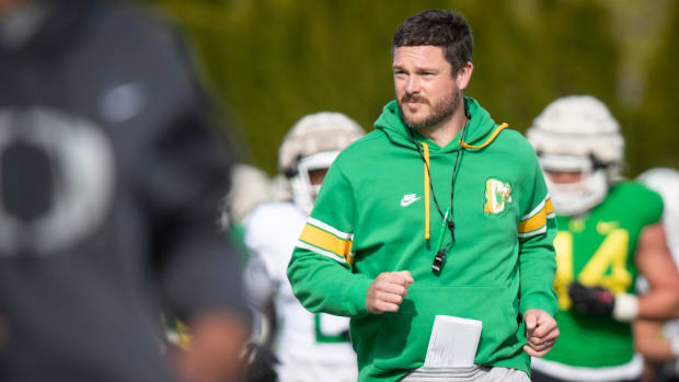 Oregon head coach Dan Lanning runs during practice with the Ducks Thursday, April 11, 2024, at the Hatfield-Dowlin Complex