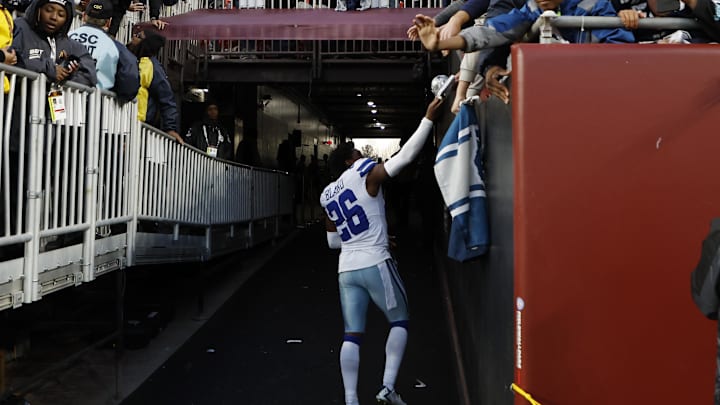 Dallas Cowboys cornerback DaRon Bland greets a fan while leaving the field after the Cowboys' game against the Washington Commanders. Dallas Cowboys cornerback DaRon Bland greets a fan while leaving the field after the Cowboys' game against the Washington Commanders.