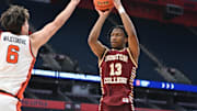 Feb 8, 2025; Syracuse, New York, USA; Boston College Eagles guard Donald Hand Jr. (13) takes a jump shot as Syracuse Orange forward Petar Majstorovic (6) defends in the first half at the JMA Wireless Dome. Mandatory Credit: Mark Konezny-Imagn Images
