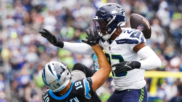 Sep 24, 2023; Seattle, Washington, USA; Seattle Seahawks cornerback Artie Burns (23) defends a pass intended for Carolina Panthers wide receiver Adam Thielen (19) during the second quarter at Lumen Field.