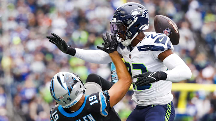 Sep 24, 2023; Seattle, Washington, USA; Seattle Seahawks cornerback Artie Burns (23) defends a pass intended for Carolina Panthers wide receiver Adam Thielen (19) during the second quarter at Lumen Field. Mandatory Credit: Joe Nicholson-Imagn Images