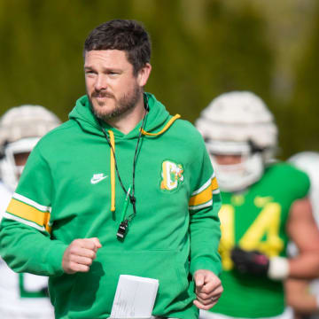 Oregon head coach Dan Lanning runs during practice with the Ducks Thursday, April 11, 2024, at the Hatfield-Dowlin Complex in Eugene, Ore.