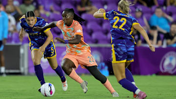 Orlando Pride's Barbra Banda dribbles past defenders in match v Utah Royals