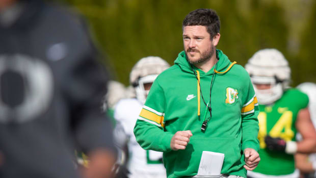 Oregon head coach Dan Lanning runs during practice with the Ducks Thursday, April 11, 2024, at the Hatfield-Dowlin Complex in