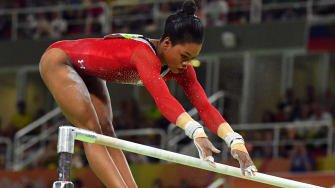 Gabby Douglas competes during the women's uneven bars finals in the 2016 Olympic Games.
