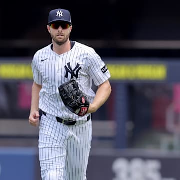 Jul 31, 2025; Bronx, New York, USA; New York Yankees right fielder Austin Slater (29) runs in from the outfield after the top of the second inning against the Tampa Bay Rays at Yankee Stadium. Mandatory Credit: Brad Penner-Imagn Images