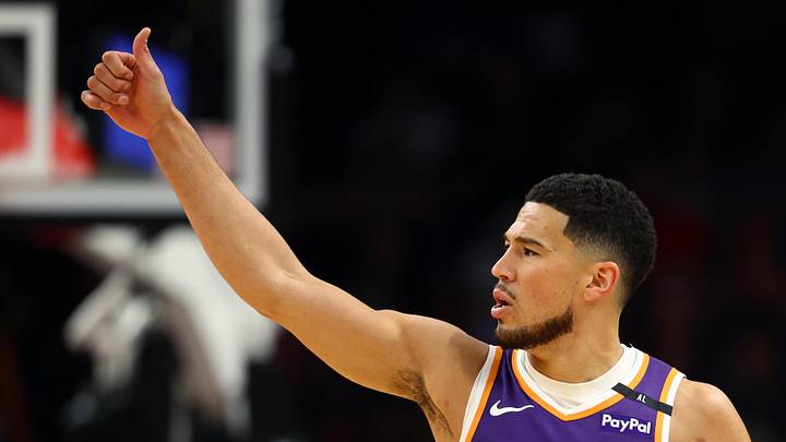 Mar 24, 2025; Phoenix, Arizona, USA; Phoenix Suns guard Devin Booker (1) reacts against the Milwaukee Bucks at Footprint Center. Mandatory Credit: Mark J. Rebilas-Imagn Images