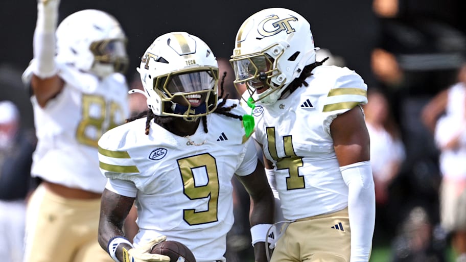 Georgia Tech defensive back Omar Daniels and defensive back Daiquan White celebrate.