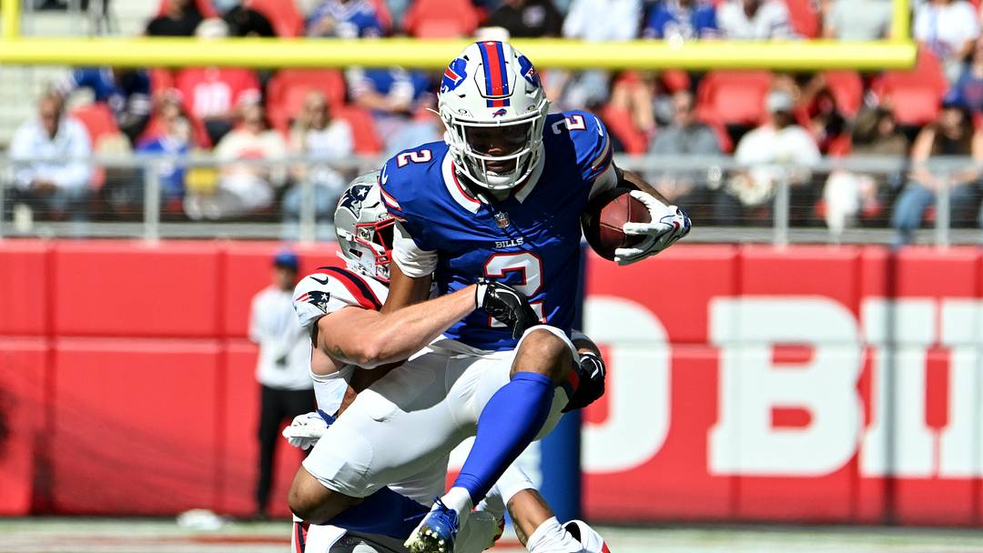 Oct 4, 2026; Orchard Park, New York, USA; Buffalo Bills wide receiver DJ Moore #2 jumps over New England Patriots cornerback Charles Woods #22 during the first quarter at New Highmark Stadium. Mandatory Credit: Mark Konezny-Imagn Images Oct 4, 2026; Orchard Park, New York, USA; Buffalo Bills wide receiver DJ Moore #2 jumps over New England Patriots cornerback Charles Woods #22 during the first quarter at New Highmark Stadium. Mandatory Credit: Mark Konezny-Imagn Images