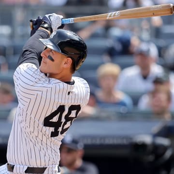 May 23, 2024; Bronx, New York, USA; New York Yankees first baseman Anthony Rizzo (48) follows through on an RBI sacrifice fly against the Seattle Mariners during the seventh inning at Yankee Stadium.