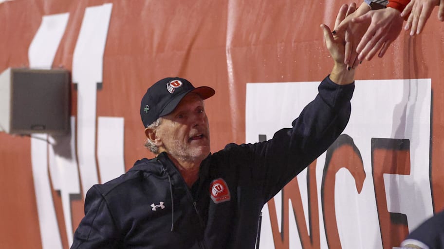 Utah Utes coach Kyle Whittingham greets students ahead of a game against Arizona State.