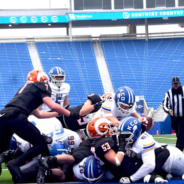 Kentucky Country Day quarterback Caden Long reaches for the touchdown, Friday, Dec. 5, in the 2025 UK Healthcare Sports Medicine State Football 1A Championship at Kroger Field on the campus of the University of Kentucky. The state title was the first for Kentucky Country Day.  