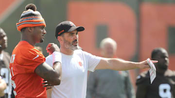 Browns quarterback Deshaun Watson talks with head coach Kevin Stefanski during a workout, Wednesday, June 8, 2022 in Berea.