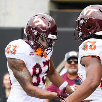 Aug 31, 2024; Nashville, Tennessee, USA;  Virginia Tech Hokies wide receiver Jaylin Lane (83) celebrates the touchdown of running back Bhayshul Tuten (33) gainst the Vanderbilt Commodores during the second half at FirstBank Stadium. Mandatory Credit: Steve Roberts-Imagn Images