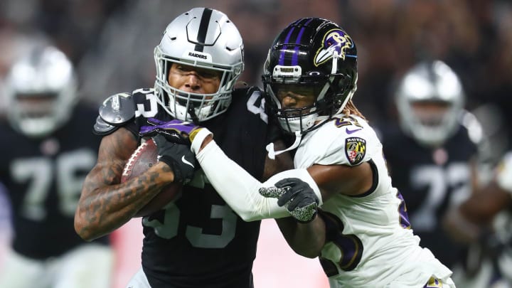 Sep 13, 2021; Paradise, Nevada, USA; Las Vegas Raiders tight end Darren Waller (83) runs the ball against Baltimore Ravens cornerback Anthony Averett (23) during the second half at Allegiant Stadium. Mandatory Credit: Mark J. Rebilas-USA TODAY Sports