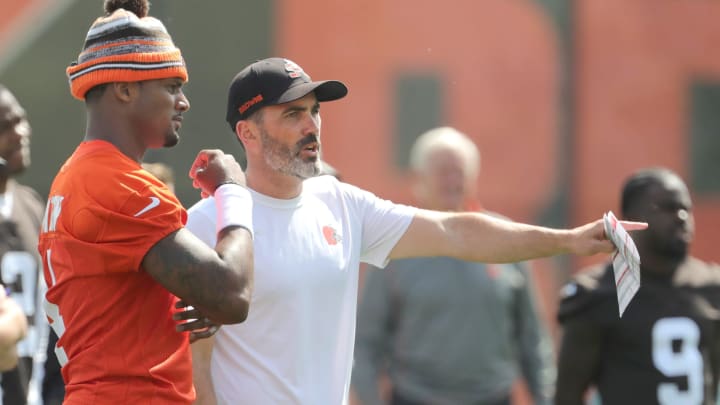 Browns quarterback Deshaun Watson talks with head coach Kevin Stefanski during a workout, Wednesday, June 8, 2022 in Berea.