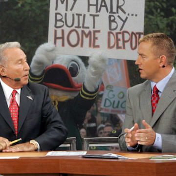 The Duck mascot pokes fun at Lee Corso's and Kirk Herbstreit's hair during taping of ESPN's Game Day in 2010.