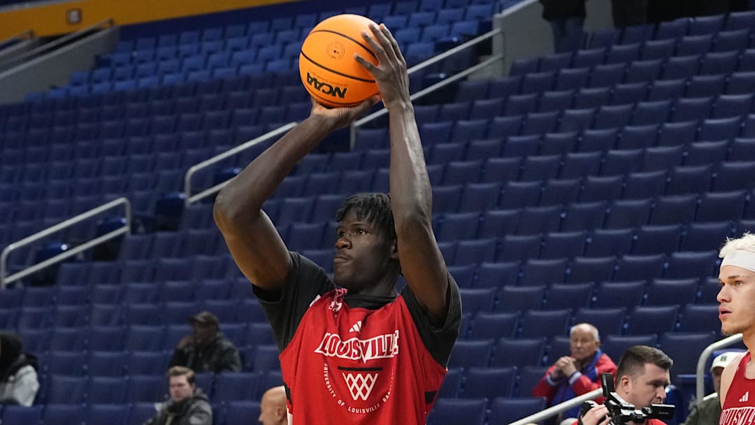 Mar 18, 2026; Buffalo, NY, USA; Louisville Cardinals Forward Mouhamed Camara (12) shoots the ball during a practice session ahead of the first round of the men's 2026 NCAA Tournament at Keybank Center. Mandatory Credit: Gregory Fisher-Imagn Images