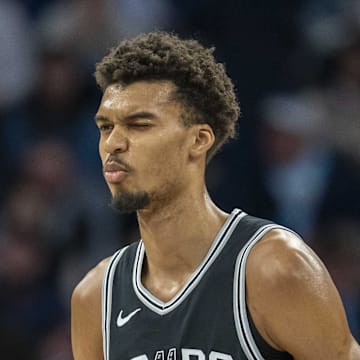 Dec 29, 2024; Minneapolis, Minnesota, USA; San Antonio Spurs center Victor Wembanyama (1) reacts after making a shot against the Minnesota Timberwolves in the first half at Target Center. Mandatory Credit: Jesse Johnson-Imagn Images