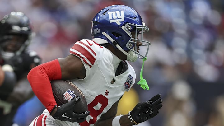 Aug 17, 2024; Houston, Texas, USA; New York Giants wide receiver Malik Nabers (9) runs with the ball during the game against the Houston Texans at NRG Stadium. Mandatory Credit: Troy Taormina-Imagn Images