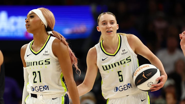 Jun 11, 2025; Phoenix, Arizona, USA; Dallas Wings guard DiJonai Carrington (21) with Paige Bueckers (5) against the Phoenix Mercury at PHX Arena. Mandatory Credit: Mark J. Rebilas-Imagn Images