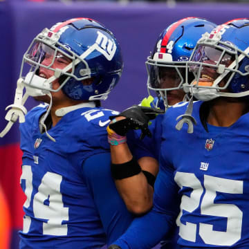 Nov 26, 2023; East Rutherford, New Jersey, USA; New York Giants cornerback Deonte Banks (25) celebrates an interception against New England Patriots in the 1st half at MetLife Stadium.  