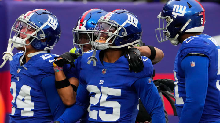 Nov 26, 2023; East Rutherford, New Jersey, USA; New York Giants cornerback Deonte Banks (25) celebrates an interception against New England Patriots in the 1st half at MetLife Stadium.  