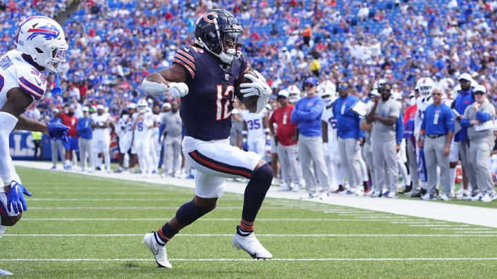 Wide receiver Velus Jones Jr. burns around left end to the end zone for a touchdown against the Bills after lining up as a running back.