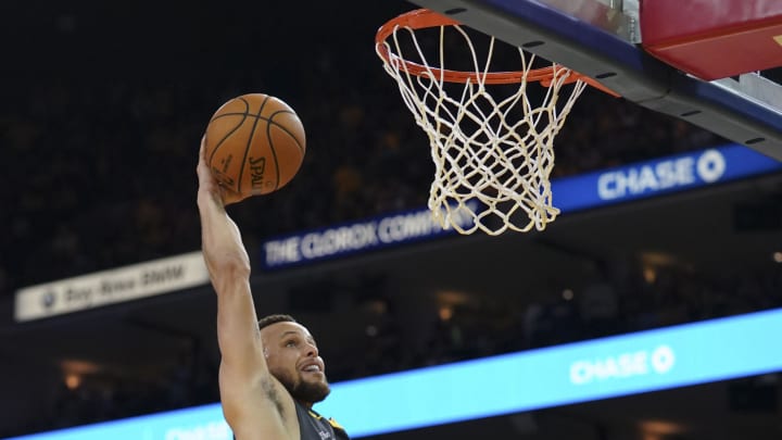 April 30, 2019; Oakland, CA, USA; Golden State Warriors guard Stephen Curry (30) dunks the basketball against the Houston Rockets during the fourth quarter in game two of the second round of the 2019 NBA Playoffs at Oracle Arena. The Warriors defeated the Rockets 115-109. Mandatory Credit: Kyle Terada-USA TODAY Sports