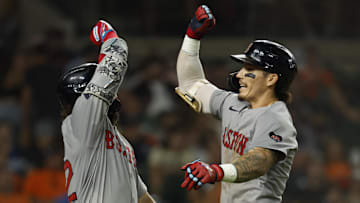 Aug 30, 2024; Detroit, Michigan, USA;  Boston Red Sox outfielder Jarren Duran (16) celebrates with outfielder Wilyer Abreu (52) after he hits a home run tenth inning against the Detroit Tigers at Comerica Park. Mandatory Credit: Rick Osentoski-Imagn Images