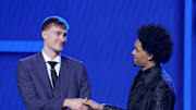 Jun 25, 2025; Brooklyn, NY, USA; Cooper Flagg and Dylan Harper shake hands on stage before the 2025 NBA Draft at Barclays Center. Mandatory Credit: Brad Penner-Imagn Images