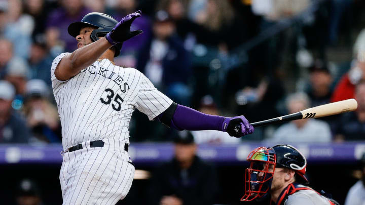 Aug 9, 2024; Denver, Colorado, USA; Colorado Rockies catcher Elias Diaz (35) hits an RBI double in the fourth inning against the Atlanta Braves at Coors Field. Mandatory Credit: Isaiah J. Downing-USA TODAY Sports