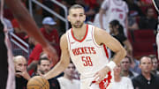 Houston Rockets guard Jack McVeigh dribbles the ball during the second half against the San Antonio Spurs at Toyota Center.