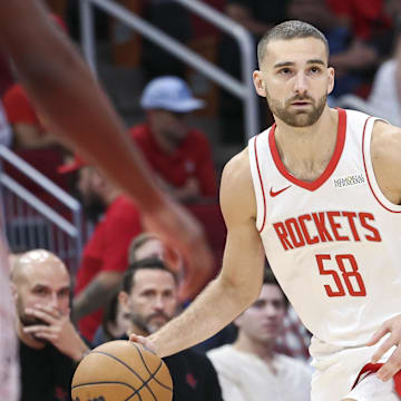 Houston Rockets guard Jack McVeigh dribbles the ball during the second half against the San Antonio Spurs at Toyota Center.