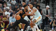 Apr 4, 2025; San Antonio, Texas, USA;  Cleveland Cavaliers guard Donovan Mitchell (45) dribbles against San Antonio Spurs guard Devin Vassell (24) in the second half at Frost Bank Center. Mandatory Credit: Daniel Dunn-Imagn Images