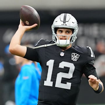 Jan 5, 2025; Paradise, Nevada, USA; Las Vegas Raiders quarterback Aidan O'Connell (12) warms up before a game against the Los Angeles Chargers at Allegiant Stadium. Mandatory Credit: Stephen R. Sylvanie-Imagn Images
