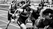 Athletes sprinting with focus and intensity—competitive fire in action.