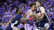 Kansas State guard Max Jones (2) dribbles between Arizona guard Anthony Dell'Orso (3) and guard K.J. Lewis (5) during the first half at Bramlage Coliseum.