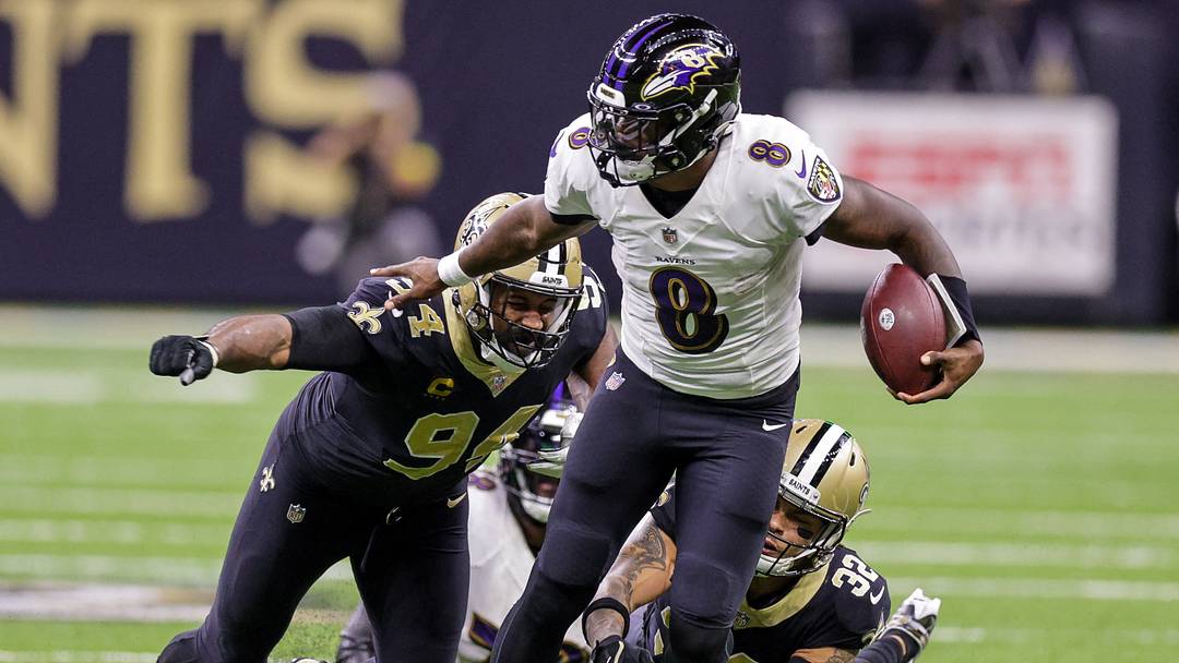 fNov 7, 2022; New Orleans, Louisiana, USA; Baltimore Ravens quarterback Lamar Jackson (8) scrambles away from New Orleans Saints defensive end Cameron Jordan (94) and safety Tyrann Mathieu (32) during the second half at Caesars Superdome. Mandatory Credit: Stephen Lew-USA TODAY Sports
