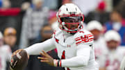 Utah Utes quarterback Devon Dampier (4) throws a pass during the first half against the Kansas Jayhawks at David Booth Kansas Memorial Stadium.