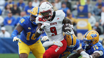 Oct 25, 2025; Pittsburgh, Pennsylvania, USA;  North Carolina State Wolfpack wide receiver Terrell Anderson (9) runs with the ball after a catch against the Pittsburgh Panthers during the first quarter at Acrisure Stadium. Mandatory Credit: Charles LeClaire-Imagn Images
