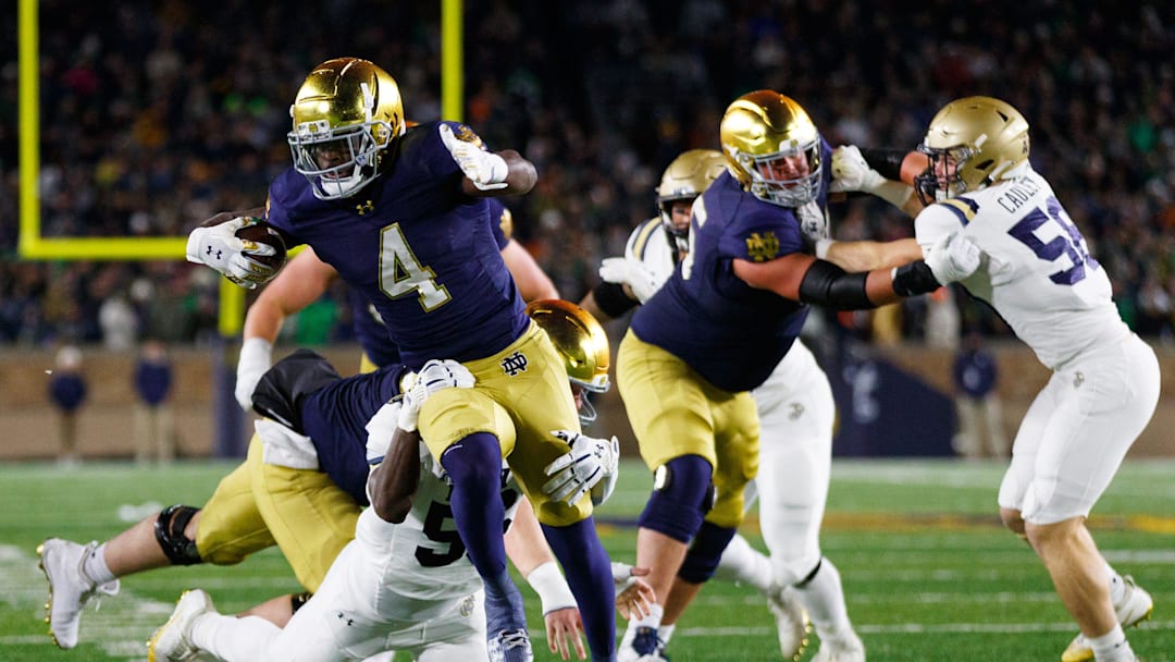 Notre Dame running back Jeremiyah Love (4) runs with the ball during the first half of a NCAA football game against Navy at Notre Dame Stadium on Saturday, Nov. 8, 2025, in South Bend.