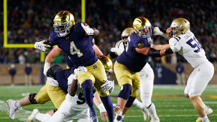 Notre Dame running back Jeremiyah Love (4) runs with the ball during the first half of a NCAA football game against Navy at Notre Dame Stadium on Saturday, Nov. 8, 2025, in South Bend.