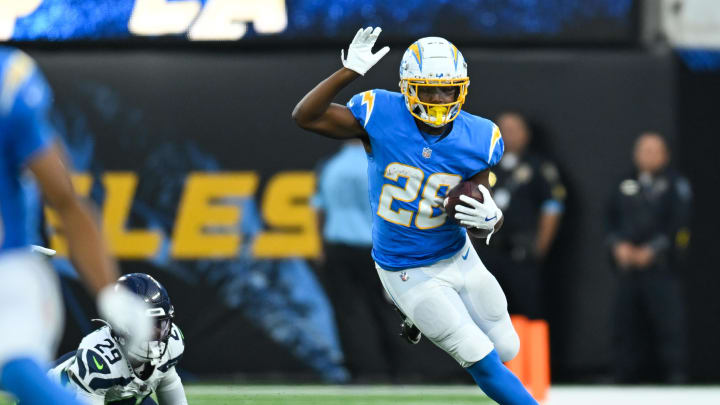 Aug 10, 2024; Inglewood, California, USA; Los Angeles Chargers running back Isaiah Spiller (28) runs the ball against the Seattle Seahawks during the fourth quarter at SoFi Stadium. Mandatory Credit: Jonathan Hui-USA TODAY Sports